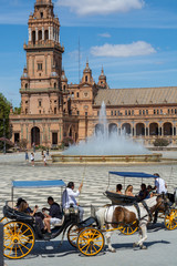 Naklejka premium September 10, 2019, Sevilla, Andalusia, Spain, tourists on Square of Spain in hot sunny day