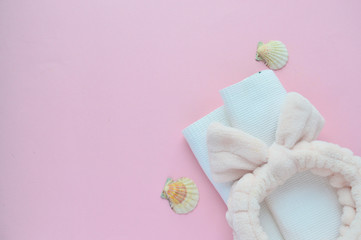 Сoncept spa, Beauty and fashion. White towel, soap, bandage, flowers on a pink background. Copy space. spa flat lay. wellness center, Beautiful composition of spa treatment and massage