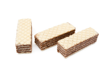 Crispy wafers with creamy hazelnut filling isolated on white background