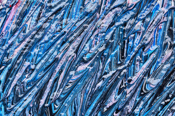 Texture and strokes of multicolored acrylic paint with sparkles on a white background