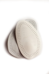 Orthopedic silicone heel from corns for the correction of different lengths of legs isolated on white background