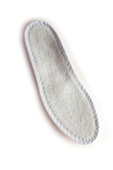 Isolated orthopedic insole on a white background. Treatment and prevention of flat feet and foot diseases. Foot care, comfort for the feet. Wear comfortable shoes. Medical insoles.