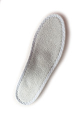 Isolated orthopedic insole on a white background. Treatment and prevention of flat feet and foot diseases. Foot care, comfort for the feet. Wear comfortable shoes. Medical insoles.
