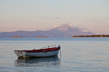 Fototapeta na wymiar Mont Athos Greece with fishing boat at foreground