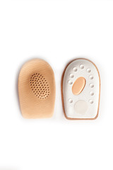 Orthopedic silicone heel from corns for the correction of different lengths of legs isolated on white background
