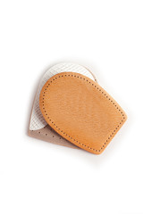 Orthopedic silicone heel from corns for the correction of different lengths of legs isolated on white background