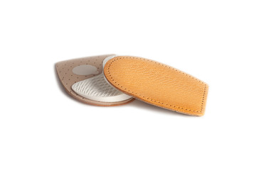 Orthopedic silicone heel from corns for the correction of different lengths of legs isolated on white background