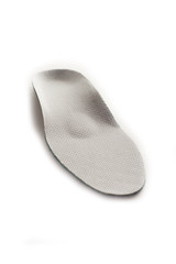 Isolated orthopedic insole on a white background. Treatment and prevention of flat feet and foot diseases. Foot care, comfort for the feet. Wear comfortable shoes. Medical insoles.