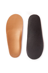 Isolated orthopedic insole on a white background. Treatment and prevention of flat feet and foot diseases. Foot care, comfort for the feet. Wear comfortable shoes. Medical insoles.