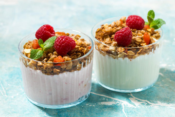 dessert with granola, raspberry, fruit and natural yoghurt