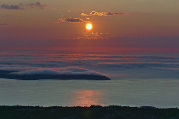 Sunrise above a fog bank in Acadia National Park