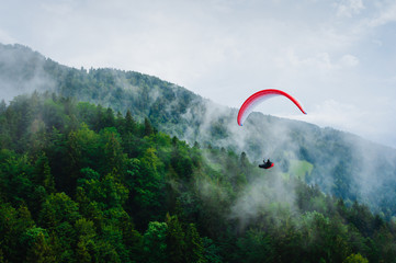 Paragliding in Austria. Alps. Clouds on the background.