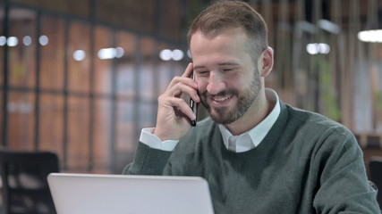 Close Up Shoot of Handsome Man talking on Smartphone