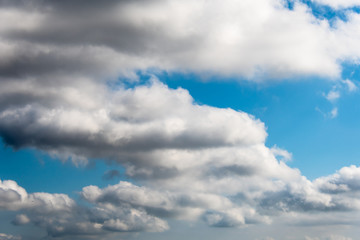 White clouds in a bright blue sky. The beauty of the nature