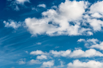White clouds in a bright blue sky. The beauty of the nature