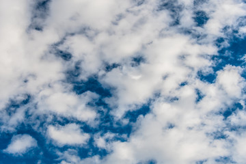 White clouds in a bright blue sky. The beauty of the nature