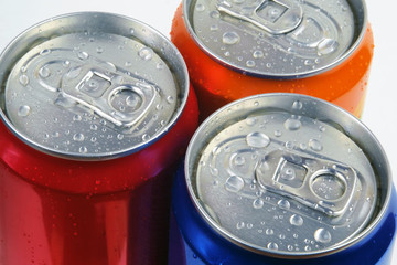 Tree color shiny drink cans with water drops