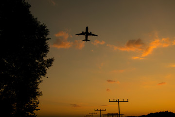Starting Airplane at the Airport Dortmund in Germany in the sunset