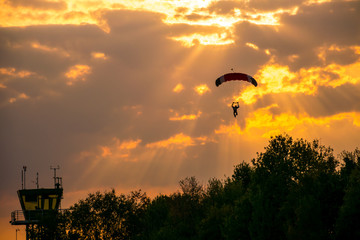 Parachutist at the airfield Soest in Sauerland Germany at sunset