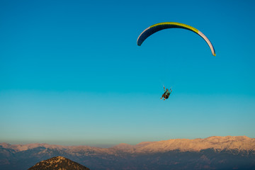 Fototapeta na wymiar Paragliding. Feeling of freedom. Beautiful view. Extreme sport.
