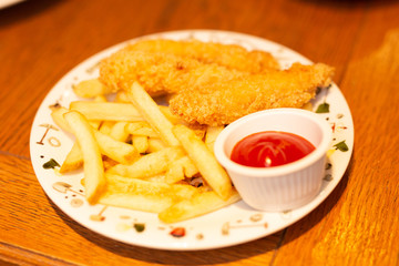 Fried chicken with french fries and nuggets meal - junk food and unhealthy food. Lunch time. American lunch dinner.