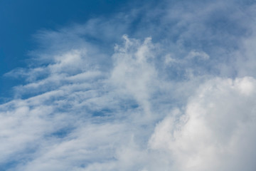 Beautiful blue sky and close-up white clouds.  Nature background .