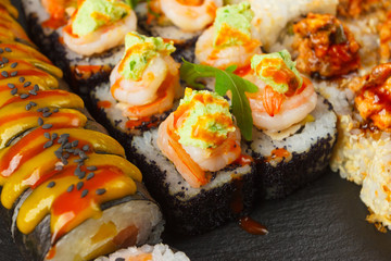 Japanese food: Set of salmon sushi and rolls with salmon and eel