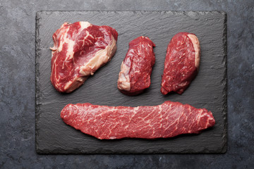 Variety of raw beef steaks
