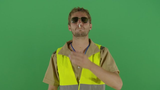 Adult Man Police Officer Putting A Cigarette On The Mouth Playing It Cool Studio Isolated Shot Against Green Screen Background