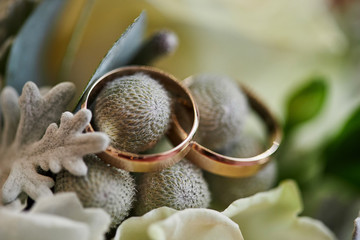 wedding rings lie on the bouquet