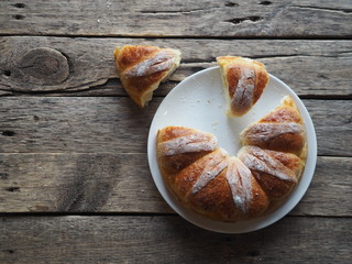 Festive Easter, Christmas or everyday bread rolls on a wooden rustic ancient table.Homemade cake. The view from the top.