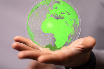 Human Hand Holding The World In Hands.