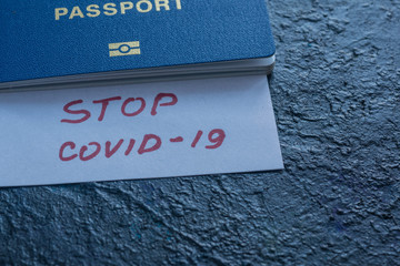 Coronavirus and travel concept. Note COVID-19 coronavirus and ukrainian passport. Novel corona...