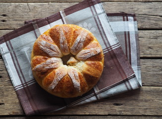 Festive Easter, Christmas or everyday bread rolls on a wooden rustic ancient table.Homemade cake. The view from the top.