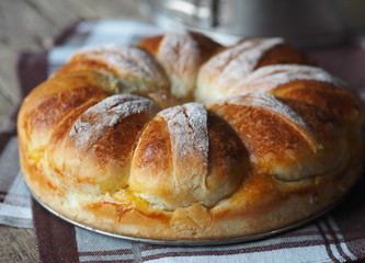 Festive Easter, Christmas or everyday bread rolls on a wooden rustic ancient table.Homemade cake. Side view.