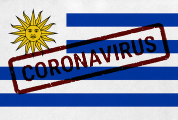 Flag of Uruguay on paper texture with stamp, banner of Coronavirus name on it. 2019 - 2020 Novel Coronavirus (2019-nCoV) concept, for an outbreak occurs in the Uruguay.