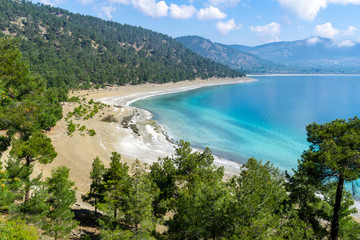 Obraz premium High angle aerial view from the Lake Salda. Lake Salda is a mid-size crater lake in southwestern Turkey, within the boundaries of Yesilova district of Burdur Province.