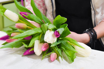 Florist collects floral bouquet. Work in a flower shop. Small business floristry