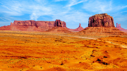 Merrick Butte, Mitten Buttes and Sentinel Mesa, a few of the massive Red Sandstone Buttes and Mesas in Monument Valley, a Navajo Tribal Park on the border of Utah and Arizona, United States