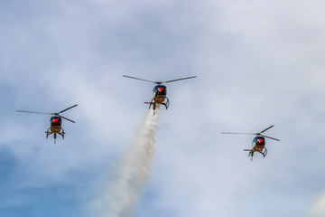 Fototapeta na wymiar Spanish Air Forces helicopters performing an aerial display in the Seville airshow 2020.
