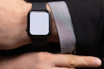 Close up of Businessman's hand looking at hand watch