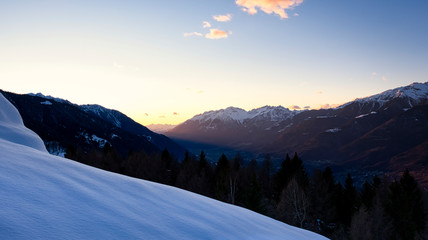 Sunset in Valtellina with the mountain snowcapped.