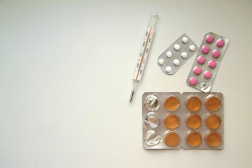 Background of pills and thermometer: pandemic virus infection from Wuhan, China, novel Coronavirus outbreak.