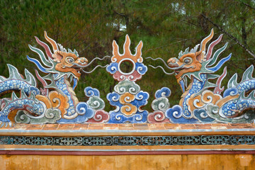 Porcelain decorations with colorful dragons at the Tomb of Tu Duc in Hue, Vietnam