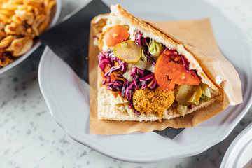 Falafel kebab in bred on bright background, fast food