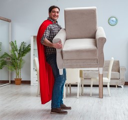 Super hero moving furniture at home