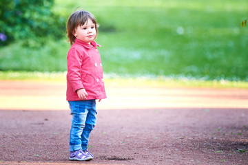 Fototapeta premium Beautiful little girl in the park