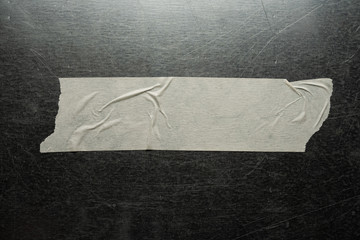 White paper tape on metal.