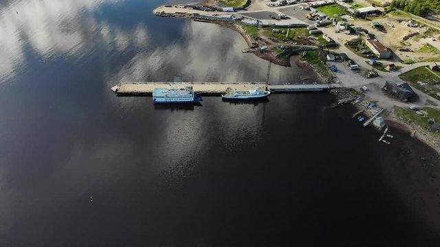 The main pier of the Solovetsky village with two ships (&ldquo;Sapphire&rdquo; and &ldquo;Vasiliy Kosyakov&rdquo;) preparing to sail on a clear day.