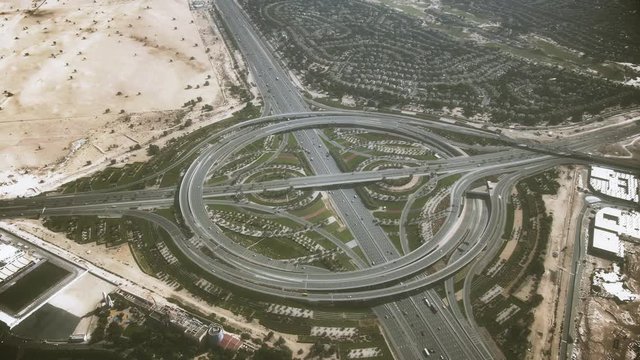 Aerial shot of a big round highway interchange in Dubai, United Arab Emirates